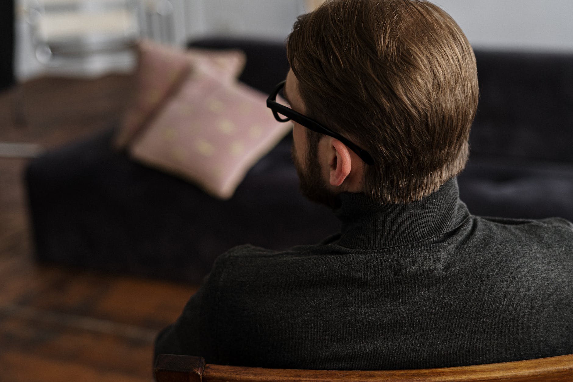 man in black sweater wearing black framed eyeglasses